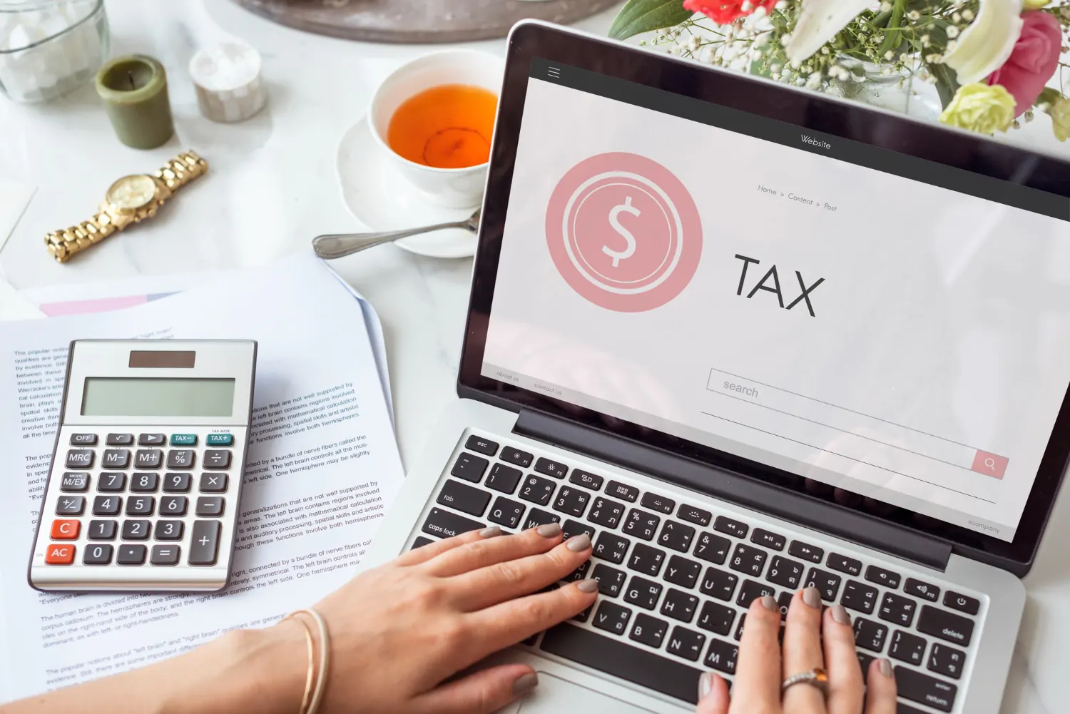 Woman calculating tax for business she owns